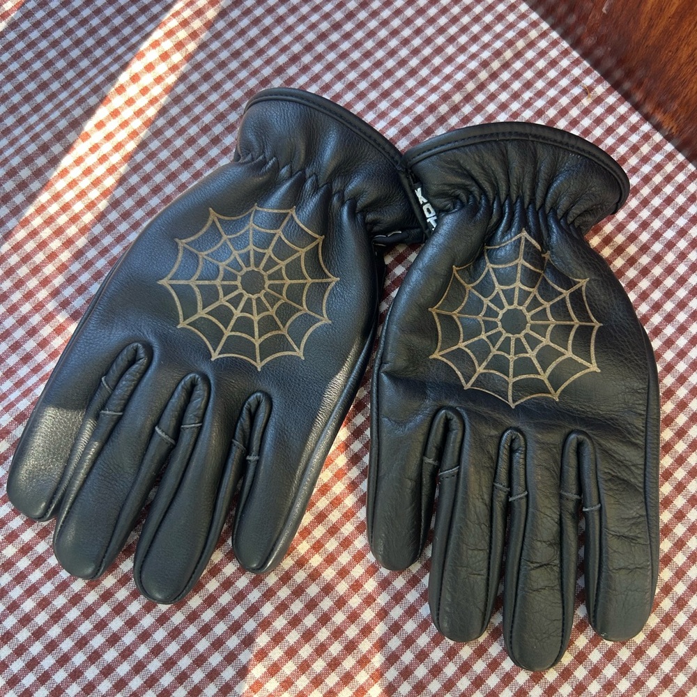 Elegant Black Gloves with Gold Web Pattern